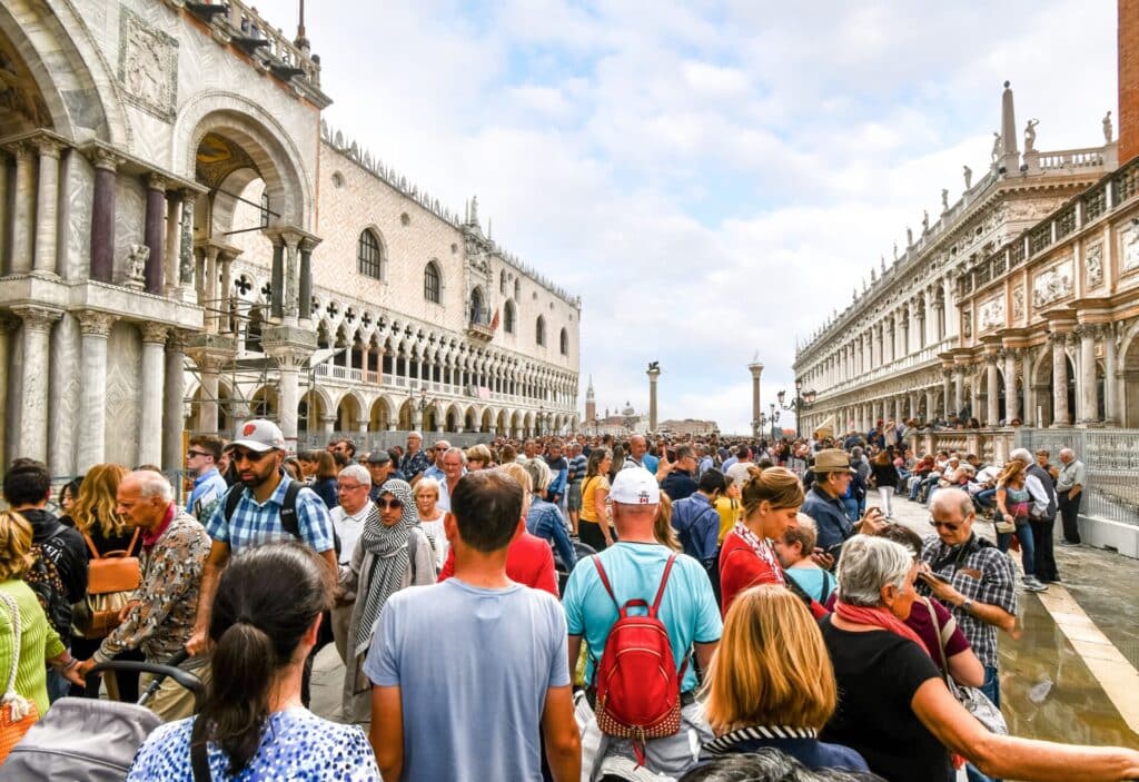 Crowds of tourists highlight the challenges of sustainable travel in a popular European destination