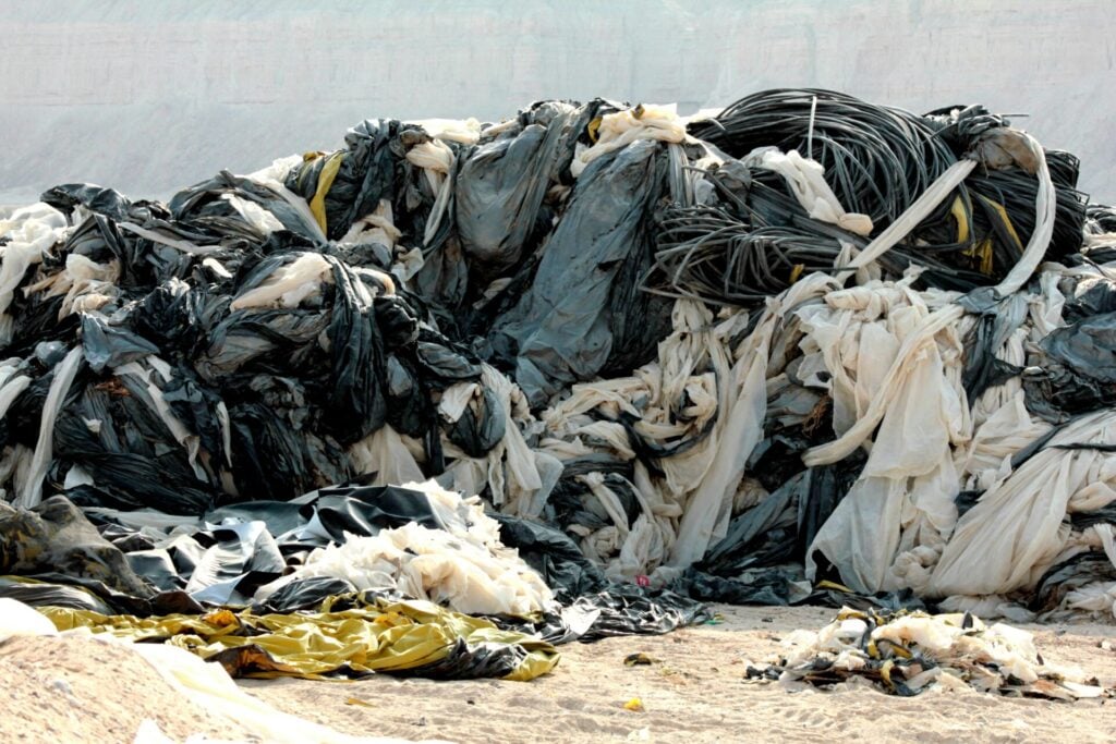 Textile waste... pile of clothes outside as trash 