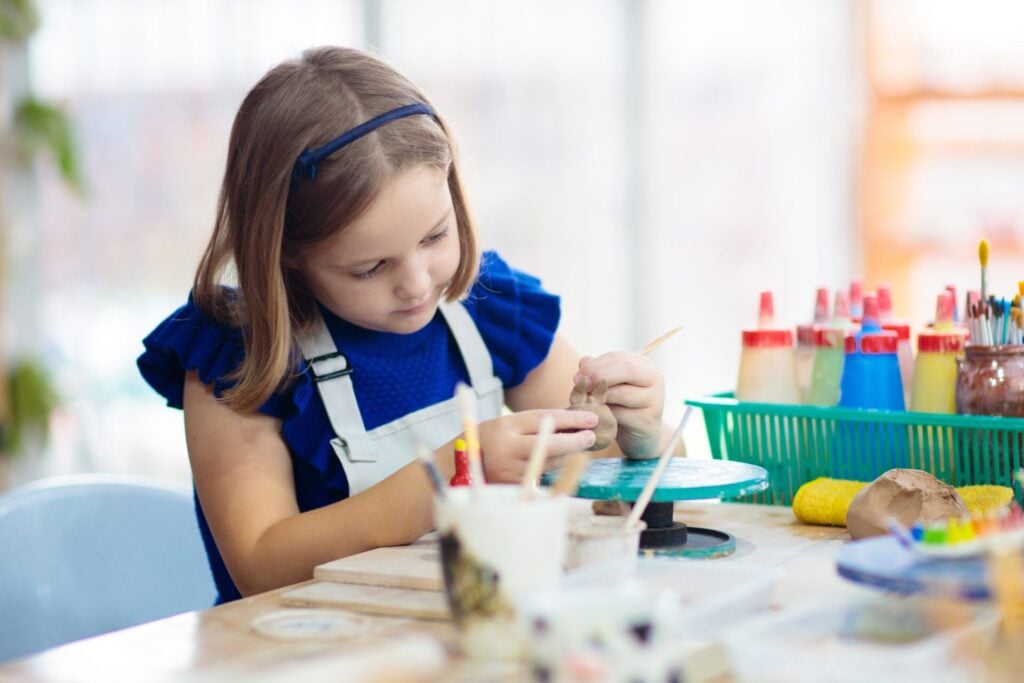 Child doing crafts in kids club