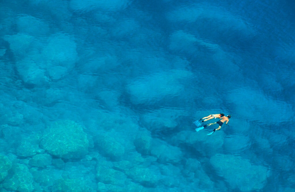 Couple snorkeling in wonderful turquoise water - Mediterranean Sea, Greece  See also