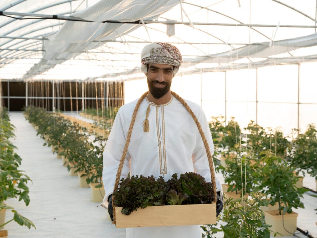 a farmer in the hydropinic farm at Alila Jabal Akhdar