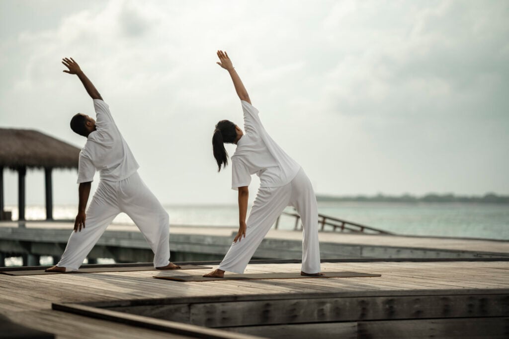 Man and woman particpating in yoga
