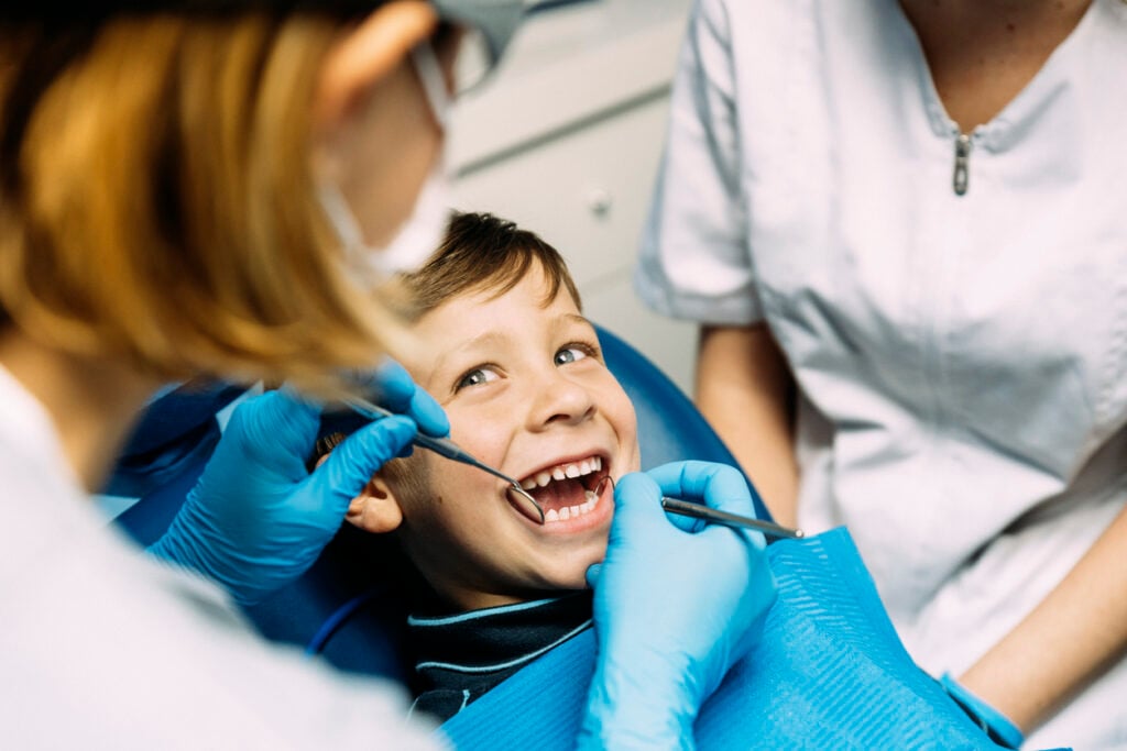 Dentist with a patient during a dental intervention. Dentist Concept