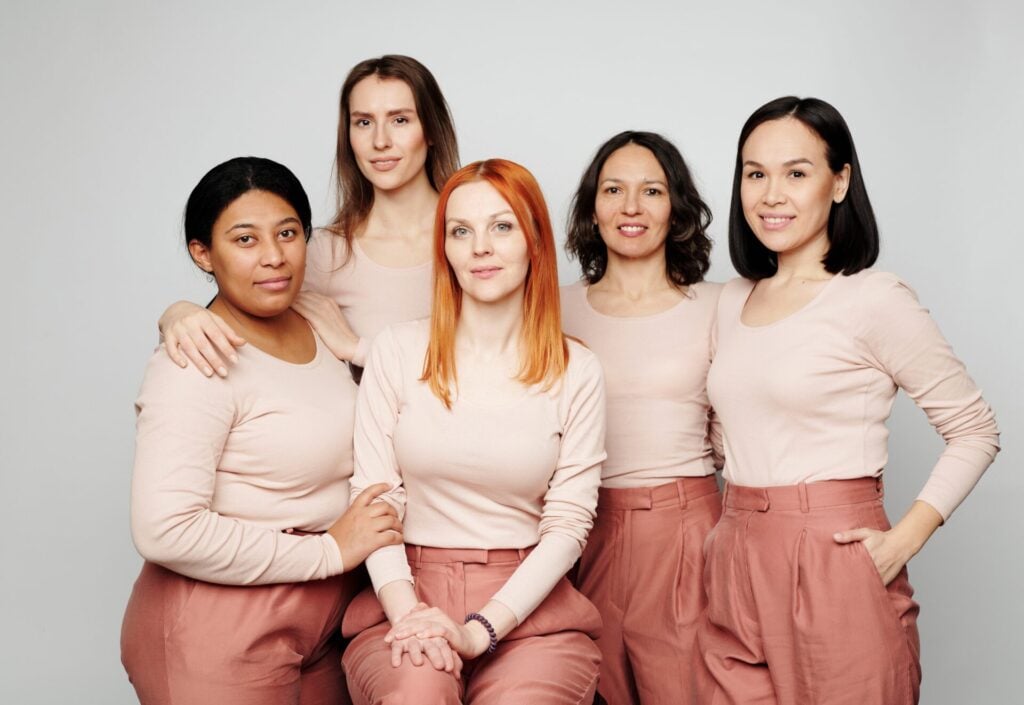 women modelling sustainable fashion brand in the same neutral colours but different sizes